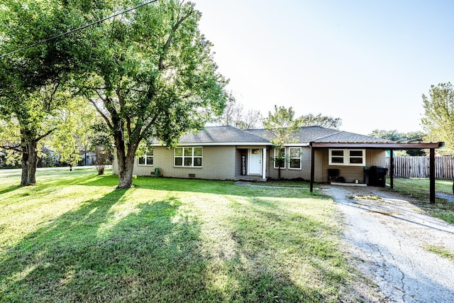 single story home featuring a carport and a front yard