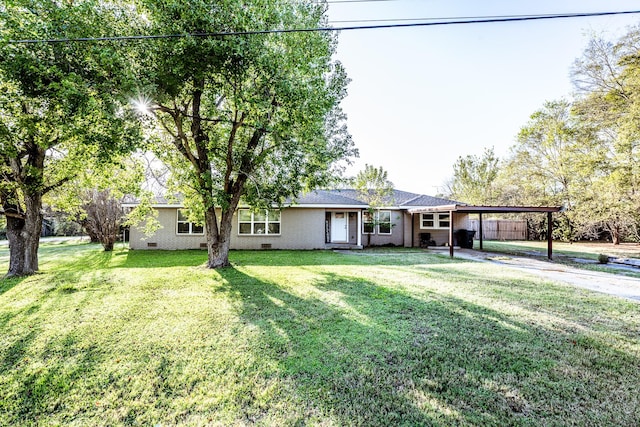 single story home with a front yard and a carport