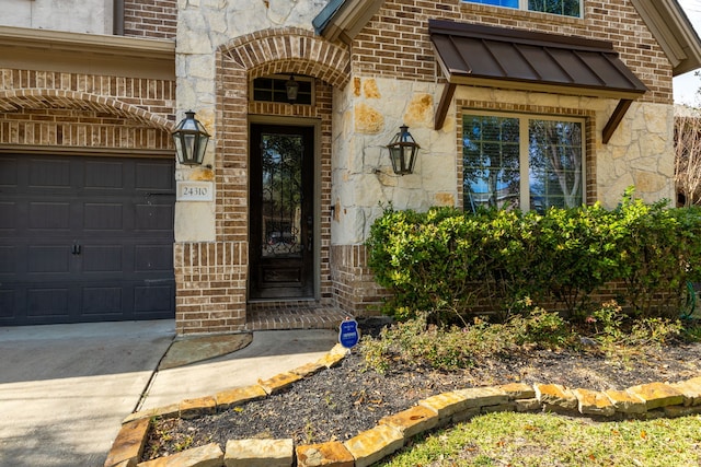 view of exterior entry with a garage