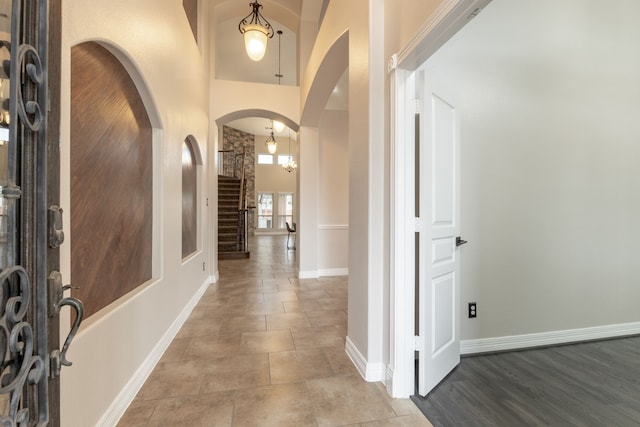 foyer featuring a towering ceiling