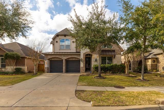 mediterranean / spanish home featuring a garage and a front lawn