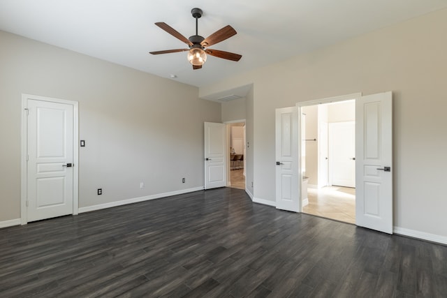 unfurnished bedroom featuring dark hardwood / wood-style floors and ceiling fan