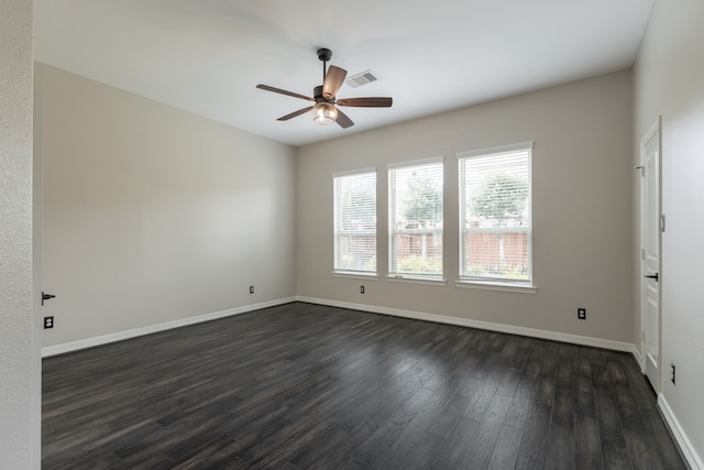 empty room featuring ceiling fan and dark hardwood / wood-style flooring