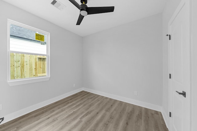 unfurnished room featuring ceiling fan and light hardwood / wood-style flooring