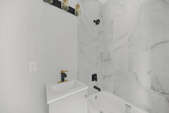 bathroom featuring vanity and tiled shower / bath combo