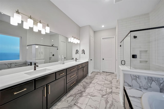 bathroom featuring vanity and an enclosed shower