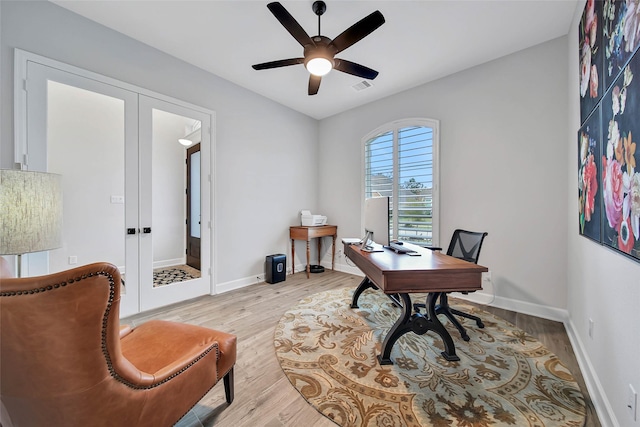 office area featuring ceiling fan, light wood-type flooring, and french doors