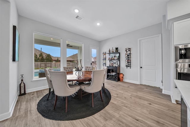 dining space featuring light hardwood / wood-style floors