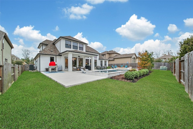 rear view of house with a fenced in pool, central AC unit, a lawn, and a patio