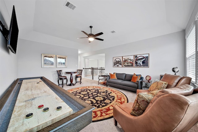 game room with carpet and ceiling fan