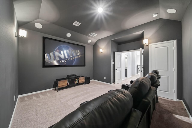 carpeted cinema room with lofted ceiling