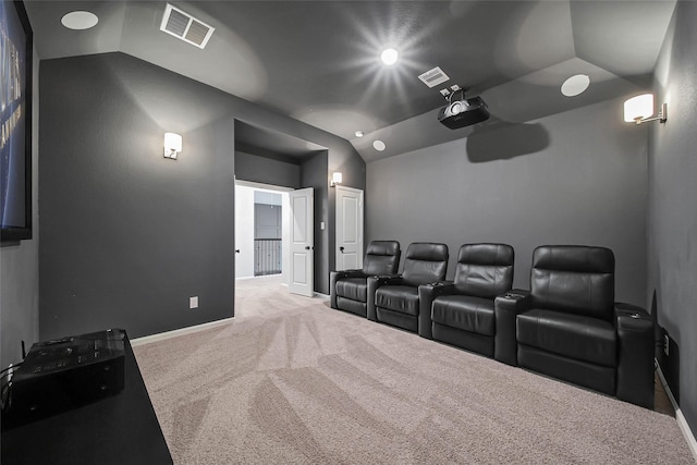 home theater with lofted ceiling and carpet flooring