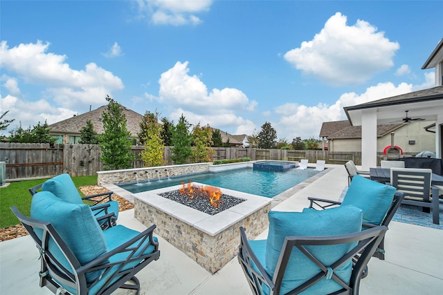 view of swimming pool with an outdoor living space with a fire pit, ceiling fan, and a patio area