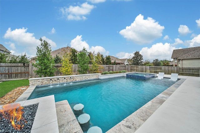 view of pool featuring pool water feature and an in ground hot tub