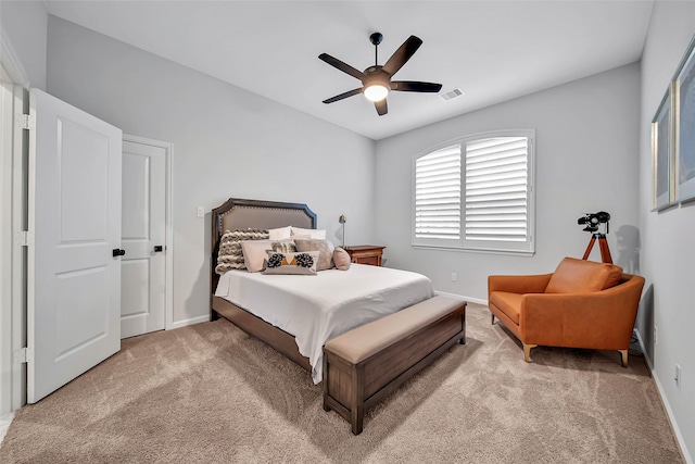 bedroom featuring light carpet and ceiling fan