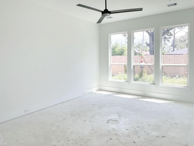 7913 Turquoise Ln, Houston, TX 77055 - unfurnished room with healthy amount of natural light, concrete flooring, and ceiling fan
