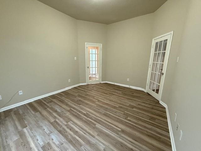 unfurnished room with hardwood / wood-style floors