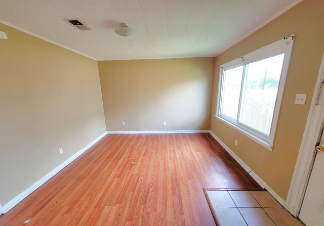 empty room with light hardwood / wood-style floors