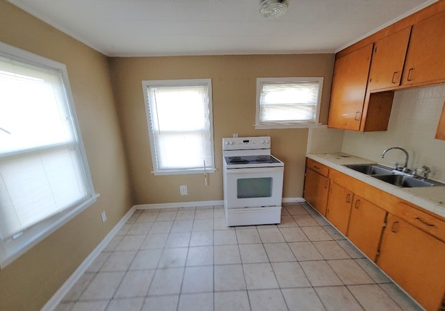 kitchen featuring sink and electric range