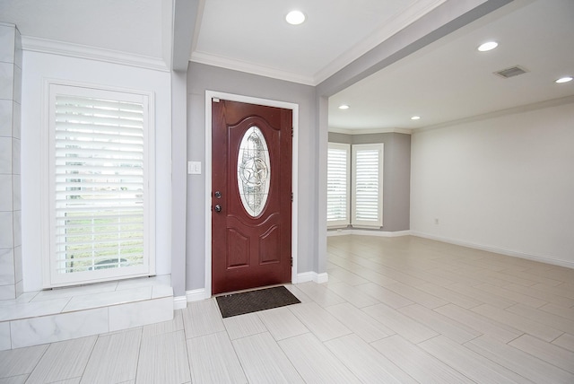 entryway featuring ornamental molding