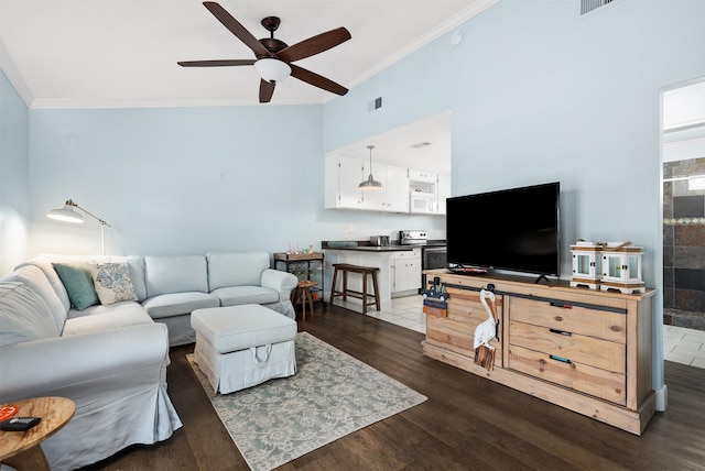 living room with dark wood-type flooring, ceiling fan, and ornamental molding