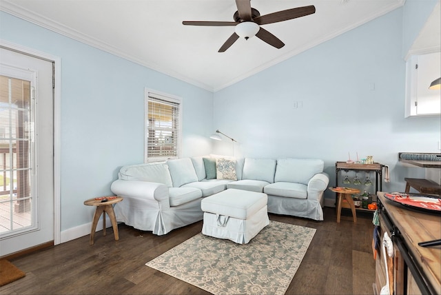 living room featuring ceiling fan, ornamental molding, and dark hardwood / wood-style floors