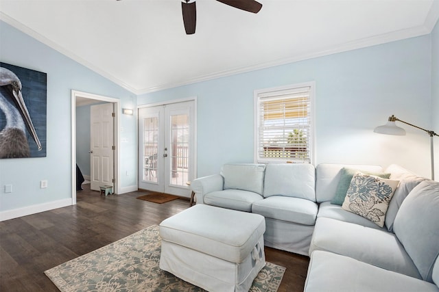 living room with crown molding, ceiling fan, dark hardwood / wood-style floors, vaulted ceiling, and french doors