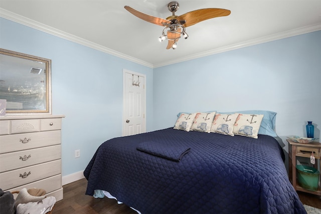 bedroom with dark wood-type flooring, ceiling fan, and crown molding