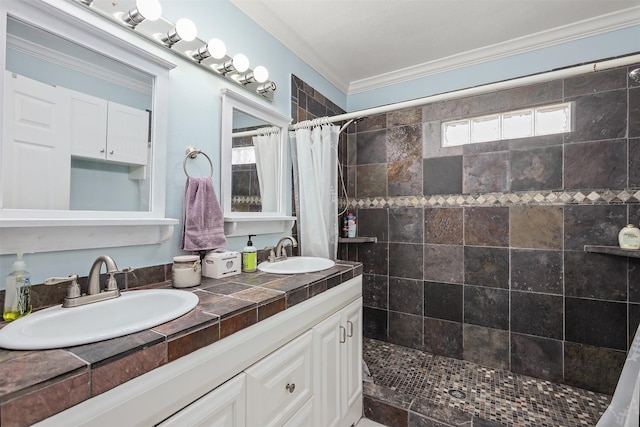 bathroom featuring ornamental molding, curtained shower, and vanity