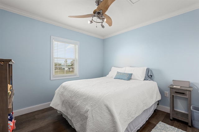 bedroom with dark hardwood / wood-style flooring, ornamental molding, and ceiling fan