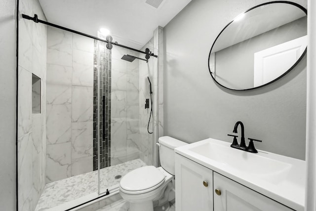 bathroom with vanity, toilet, and an enclosed shower