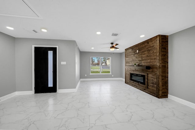 unfurnished living room featuring a fireplace and ceiling fan