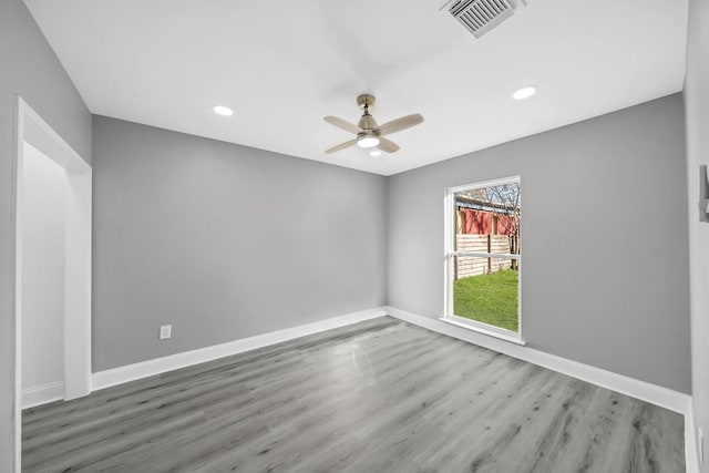 unfurnished room featuring hardwood / wood-style floors and ceiling fan