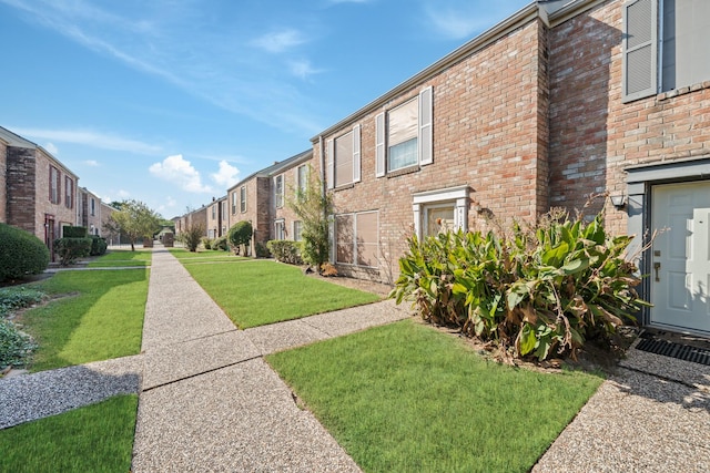 view of community with a yard