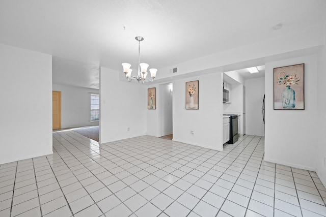 interior space with an inviting chandelier and light tile patterned floors