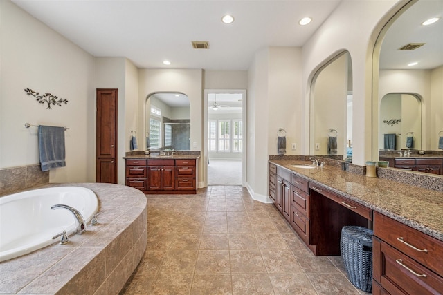 bathroom with vanity, tile patterned floors, plus walk in shower, and ceiling fan