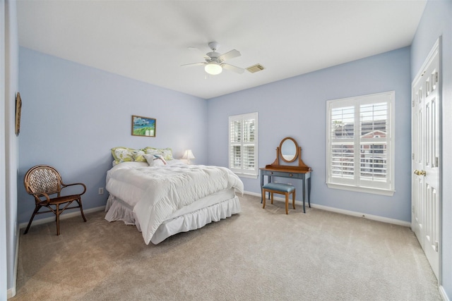 carpeted bedroom with ceiling fan