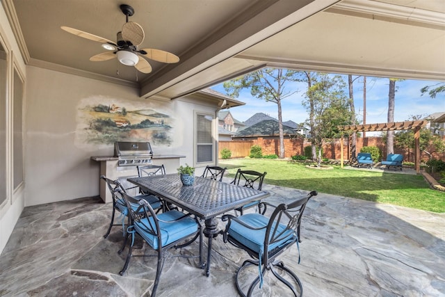 view of patio with a grill, ceiling fan, and exterior kitchen