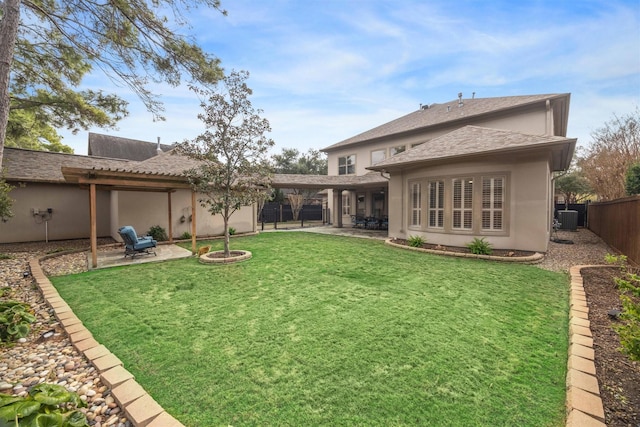 back of house with a lawn, a patio, and central air condition unit