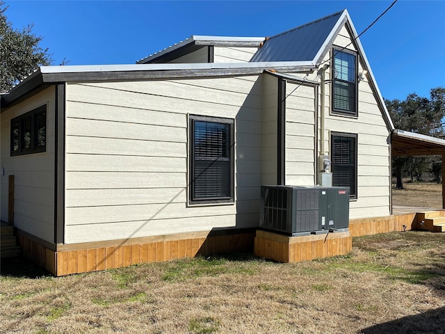 TRACT2 Private Road 648th St, Cedar Lake, TX 77414 - view of side of property featuring central air condition unit and metal roof