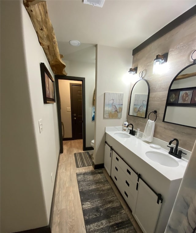 TRACT2 Private Road 648th St, Cedar Lake, TX 77414 - full bath featuring double vanity, toilet, wood finished floors, and a sink