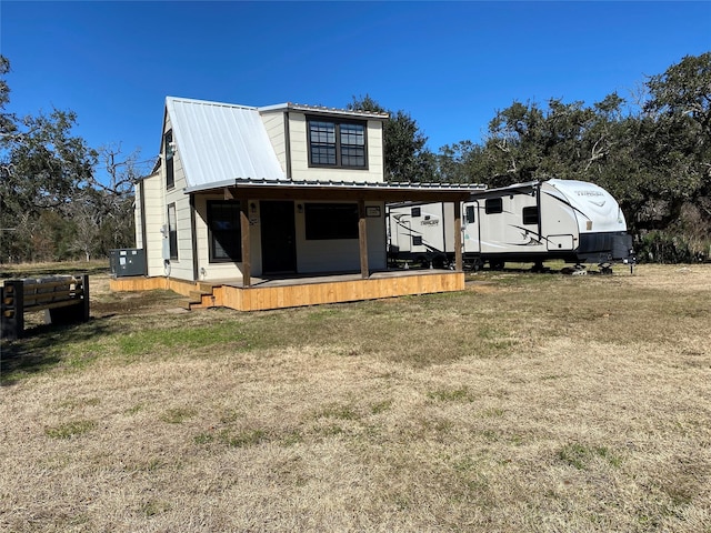 TRACT2 Private Road 648th St, Cedar Lake, TX 77414 - view of front facade featuring central air condition unit, metal roof, and a front lawn