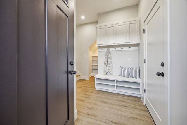 mudroom with light hardwood / wood-style floors