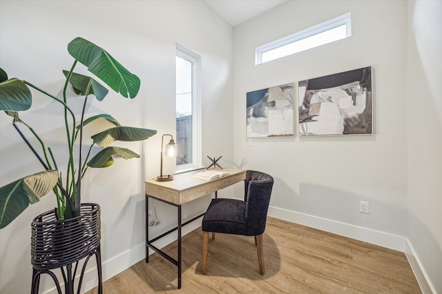 office with light hardwood / wood-style floors