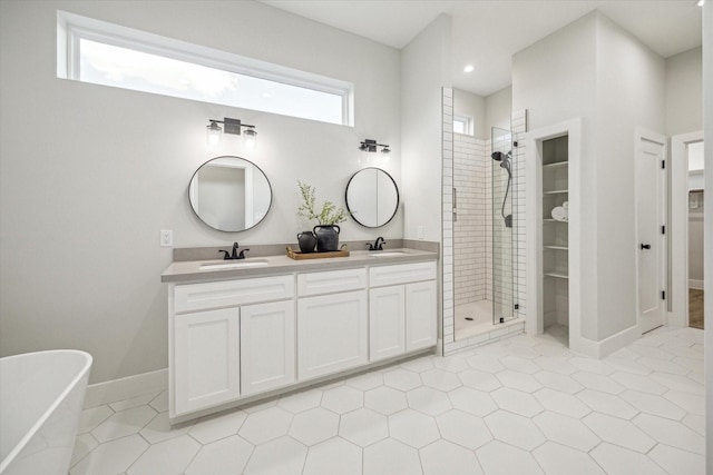 bathroom featuring vanity, tile patterned floors, and separate shower and tub