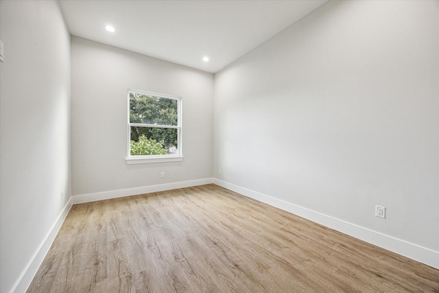 unfurnished room featuring light hardwood / wood-style floors