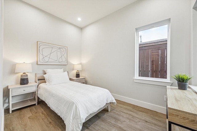 bedroom with light wood-type flooring