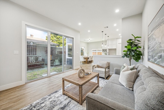 living room with light hardwood / wood-style floors