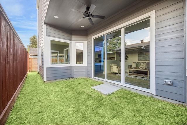 exterior space featuring ceiling fan