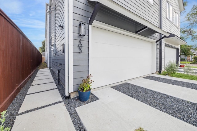 view of side of property with a garage